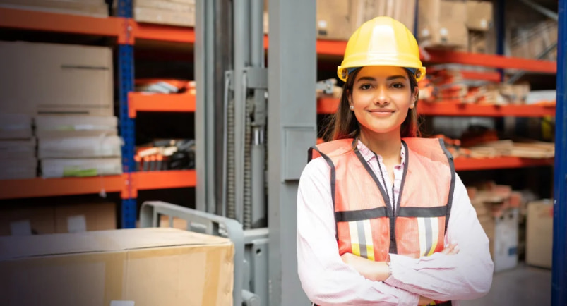 A large, modern e-commerce warehouse in Dubai, representing logistics jobs for Indians